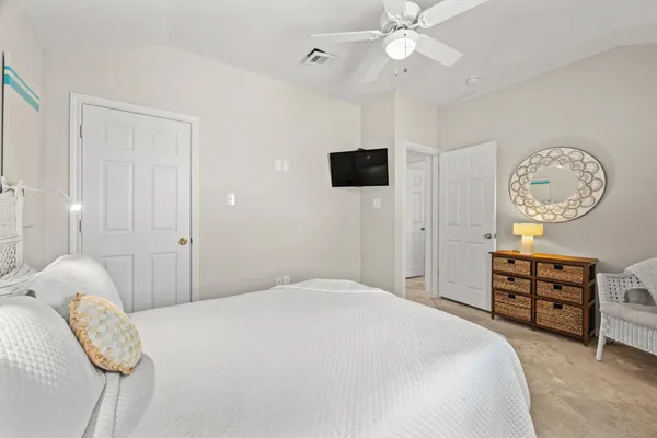 a bedroom with a bed and a table in it