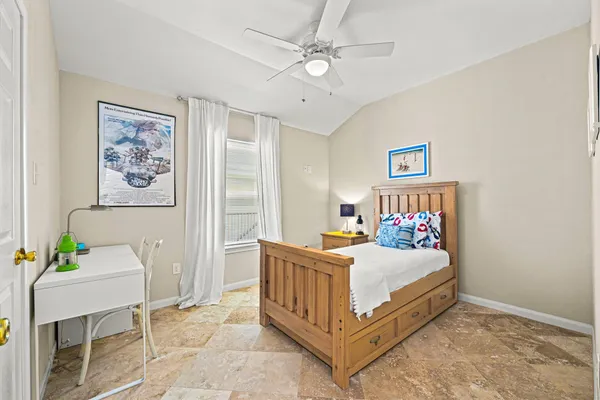 a bedroom with a bed and a tv