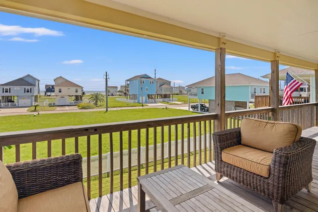 a view of a balcony with dining area