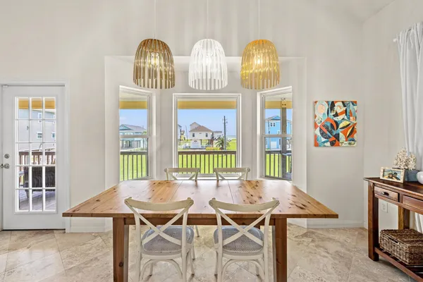 a view of a dining room with furniture a livingroom and wooden floor
