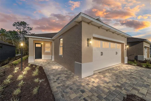 a view of a house with backyard