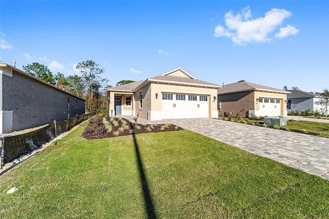 a view of house with yard outdoor seating and entertaining space