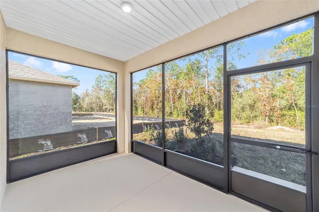 a living room with large windows