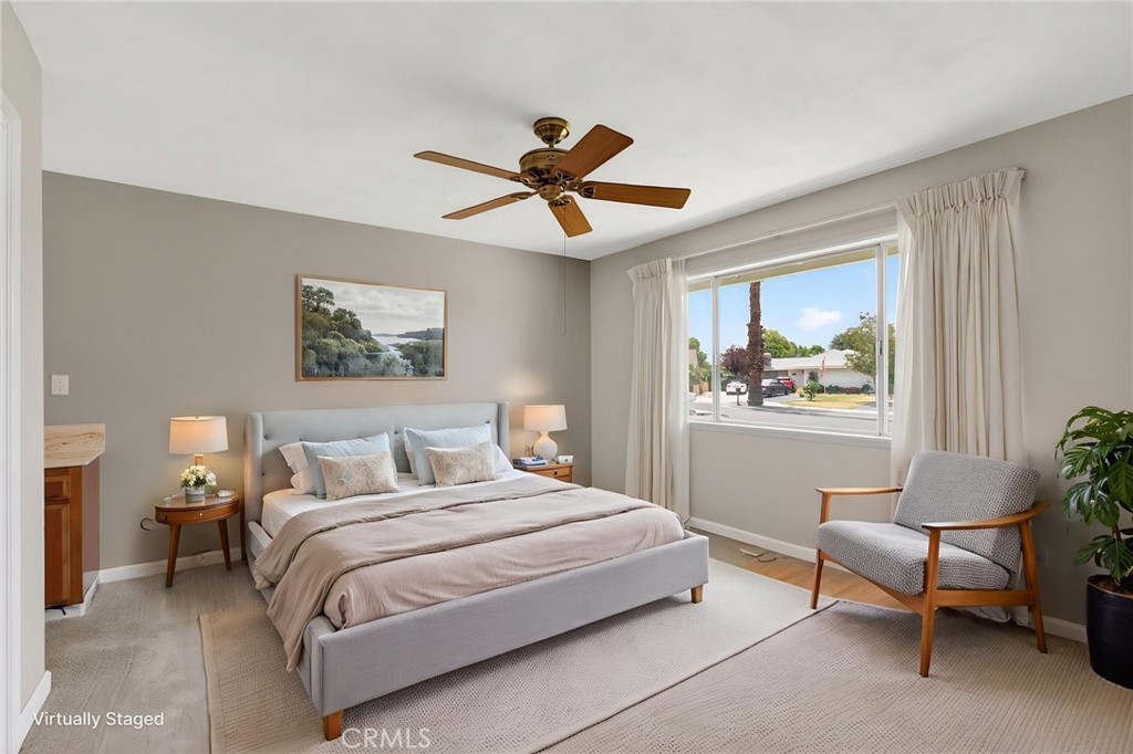 4963 Carlingford Avenue Riverside, CA 92504 - Photo 14 of 33 a bedroom with a bed and a painting on the wall