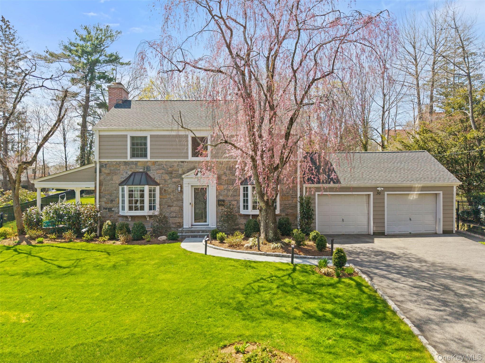 Welcome to 30 Corell Road!A classic Scarsdale  colonial with beautifully manicured grounds, mature plantings, and exceptional curb appeal.