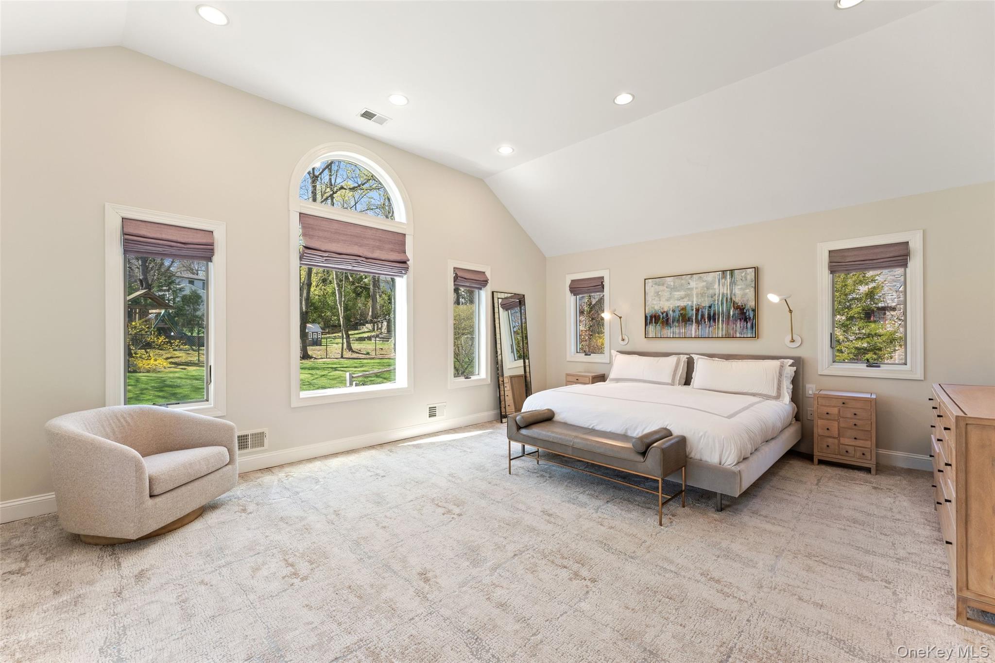 30 Corell Road Scarsdale, NY 10583 - Photo 15 of 32 Serene and oversized primary bedroom retreat featuring soaring ceilings, new primary bath, updated walk-in closets, and expansive windows