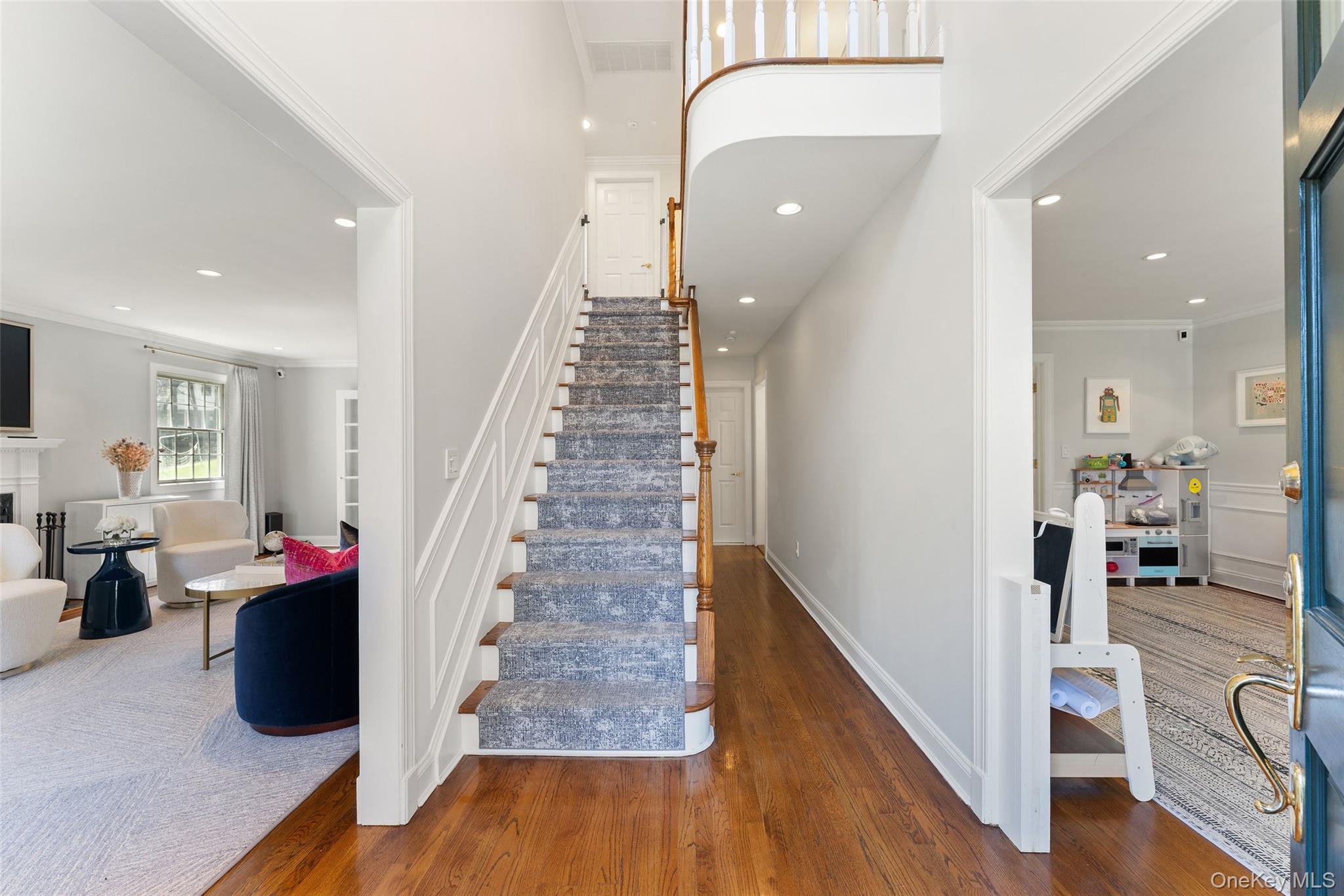 30 Corell Road Scarsdale, NY 10583 - Photo 2 of 32 Gracious foyer entry with hardwood floors, classic millwork, and a bright, open layout.