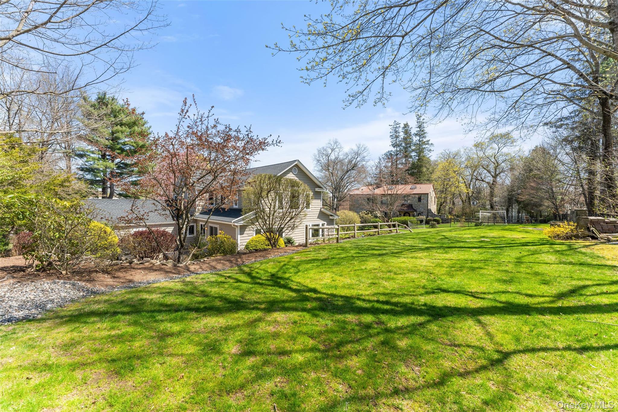 30 Corell Road Scarsdale, NY 10583 - Photo 25 of 32 Expansive backyard with sweeping lawn space, beautiful landscaping, and endless room for play or entertaining.