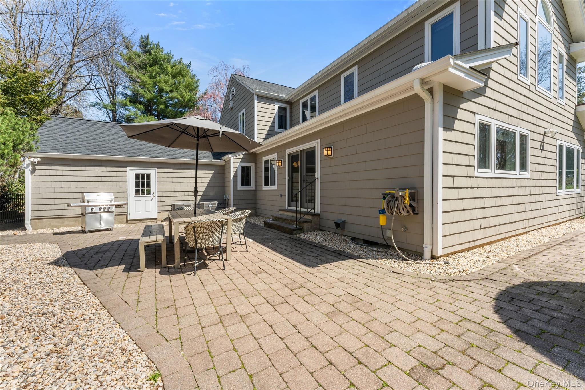 30 Corell Road Scarsdale, NY 10583 - Photo 26 of 32 Beautiful stone patio offering an ideal setting for outdoor dining, grilling, and everyday gatherings and entertaining.