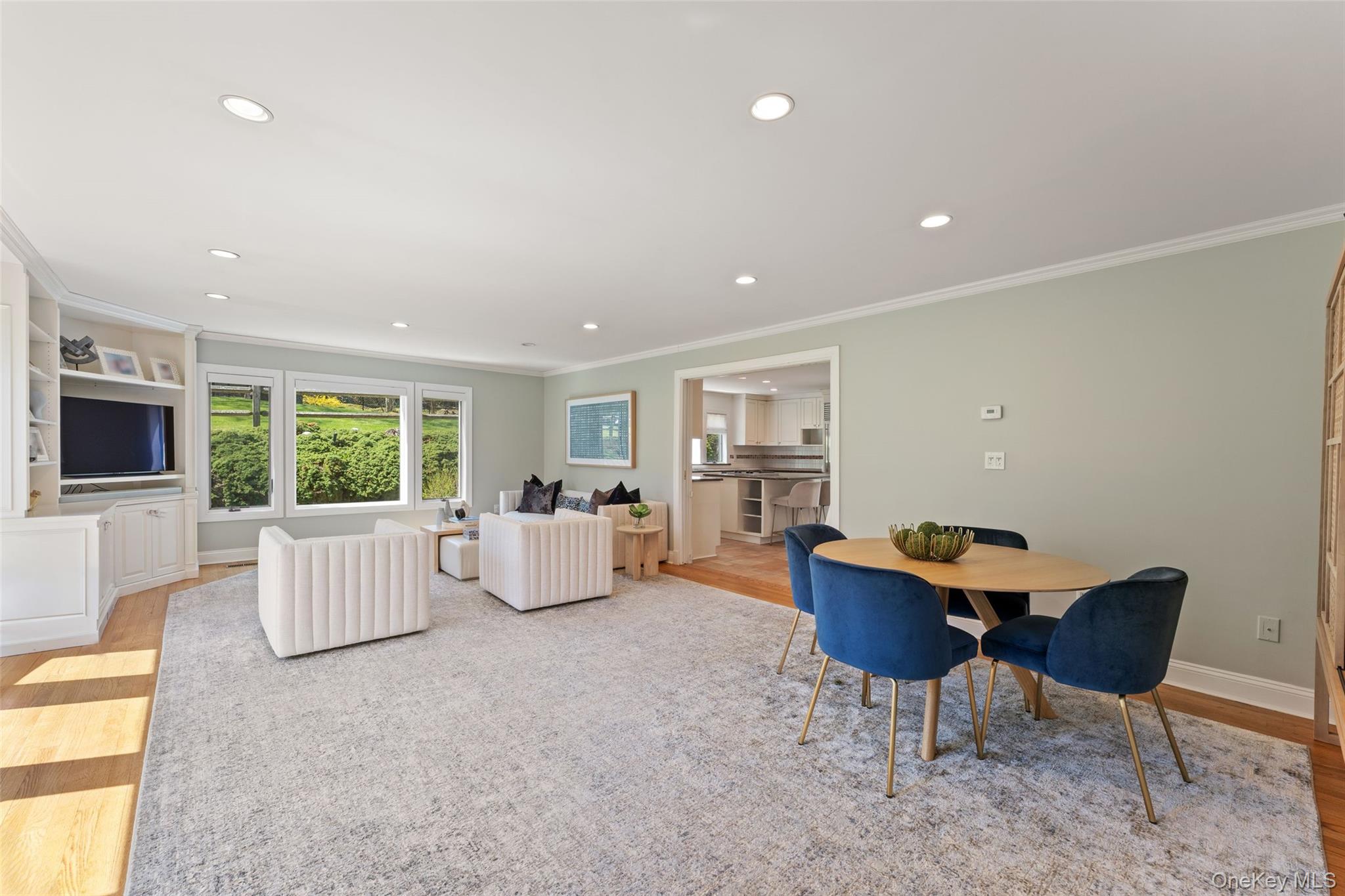 30 Corell Road Scarsdale, NY 10583 - Photo 4 of 32 Alternate view of the family room, showcasing its seamless flow into the kitchen for easy everyday living and entertaining.