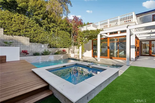 a view of house with yard entertaining space and seating area