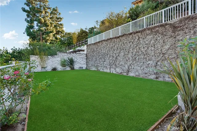a view of a porch and garden