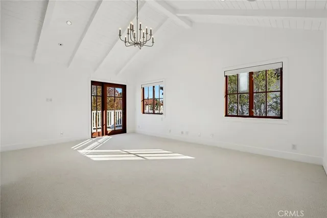 a bathroom with a tub a sink and a window
