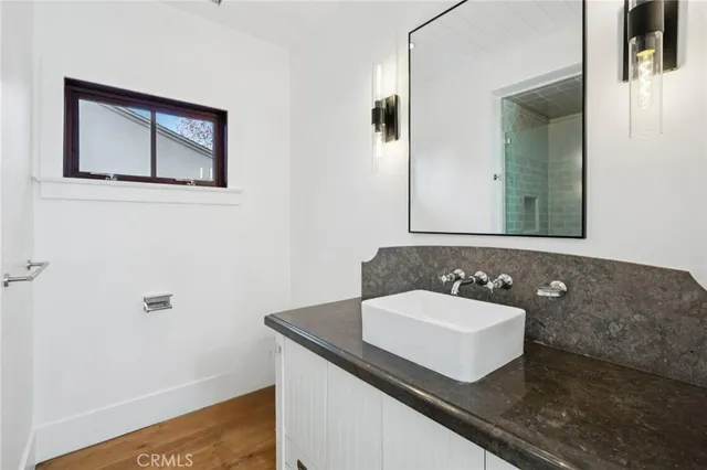 a utility room with sink dryer and washer