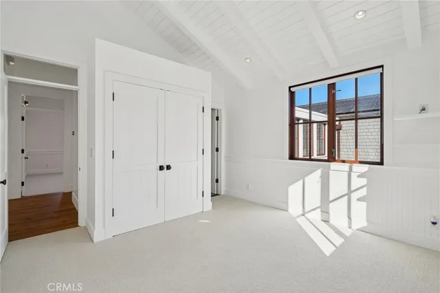 an aerial view of a house with a lake view