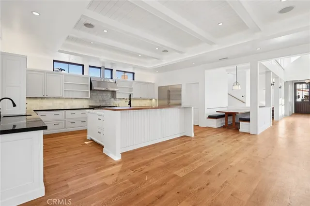 a view of an empty room with a fireplace and a window