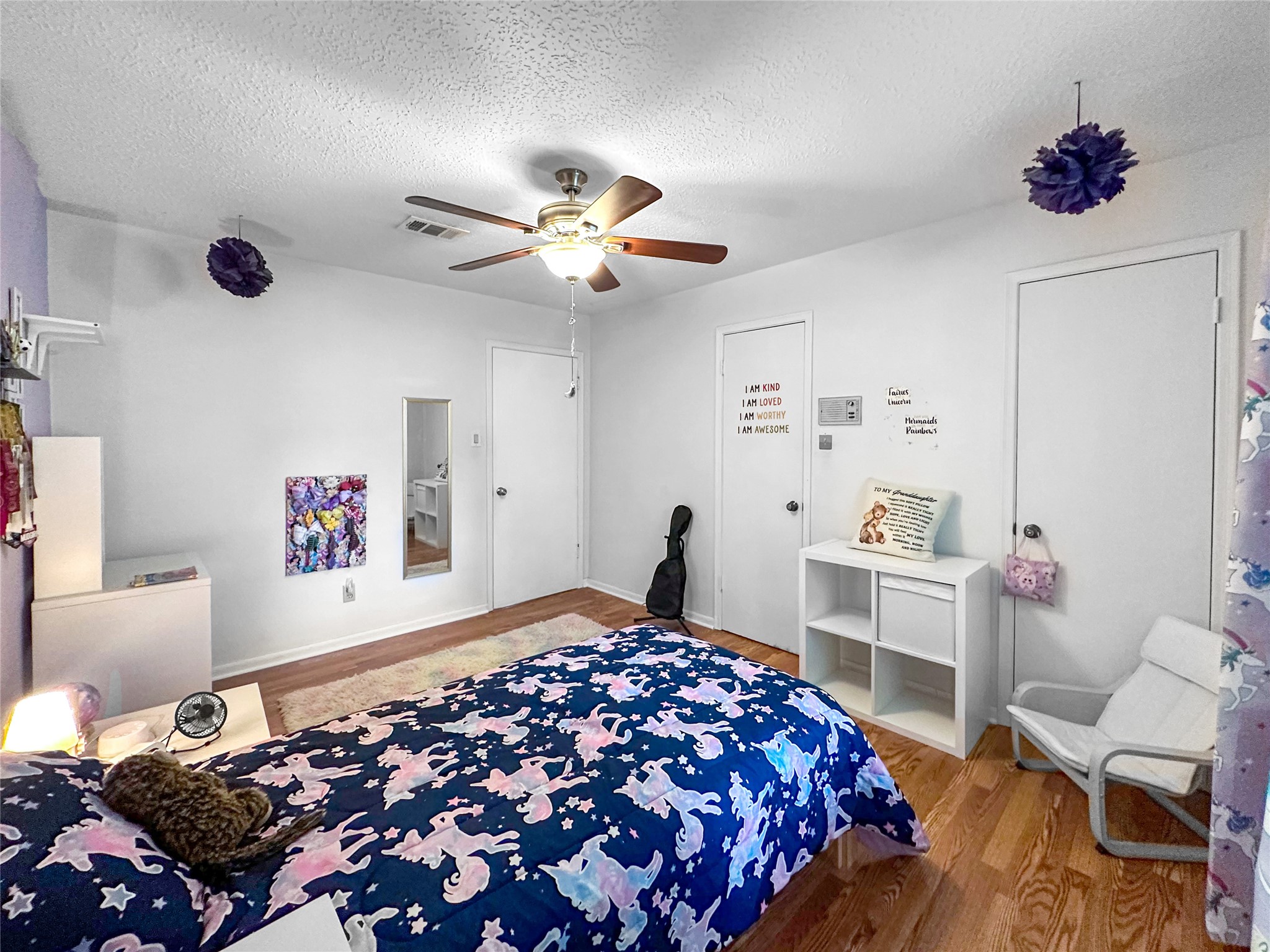 6511 Castle Pine Lane Spring, TX 77379 - Photo 32 of 49 Comfortable bedroom space featuring wood-look flooring and a cozy atmosphere ideal for relaxation or personalization. Dual closet doors. Bedroom #4