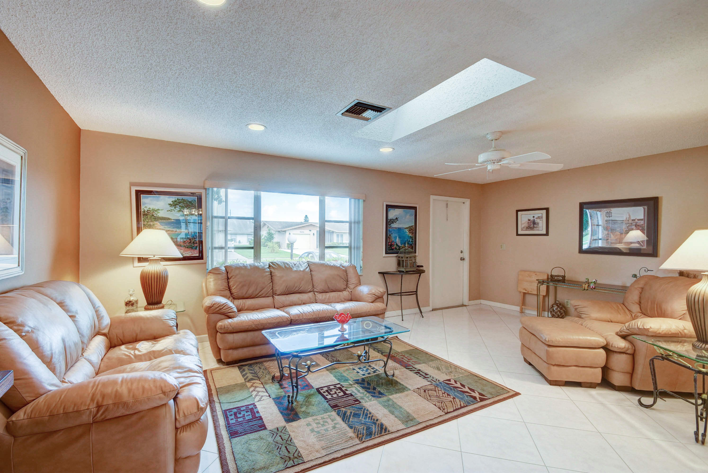 6295 Dusenburg Road Delray Beach, FL 33484 - Photo 1 of 34 a living room with furniture and a rug