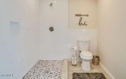 1514 West Bethany Home Road Phoenix, AZ 85015 - Photo 10 of 11 a bathroom with a toilet and a shower