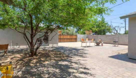 1514 West Bethany Home Road Phoenix, AZ 85015 - Photo 2 of 11 a view of a yard with a tree
