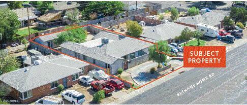 1514 West Bethany Home Road Phoenix, AZ 85015 - Photo 3 of 11 an aerial view of a house with a garden and mountain view in back
