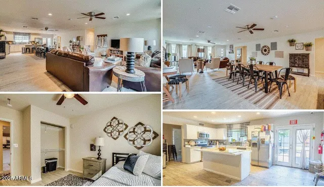 a living room with lots of furniture and kitchen view