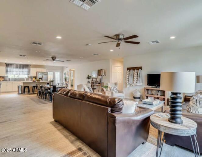 1514 West Bethany Home Road Phoenix, AZ 85015 - Photo 5 of 11 a living room with furniture and a wooden floor