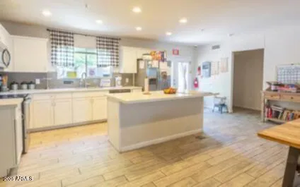 a kitchen with stainless steel appliances granite countertop a sink and cabinets