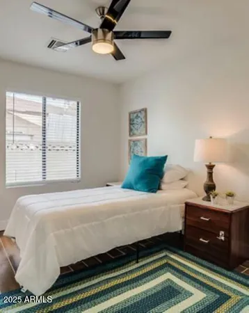 a bedroom with a bed and window