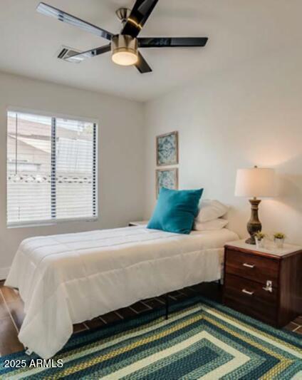 1514 West Bethany Home Road Phoenix, AZ 85015 - Photo 9 of 11 a bedroom with a bed and window