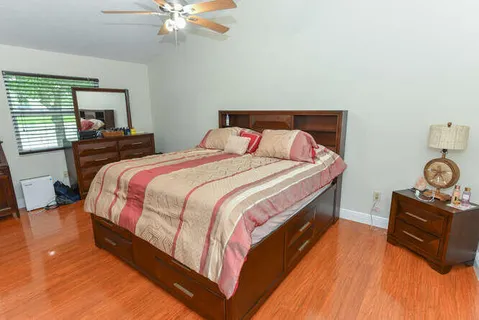 a bedroom with bed and window