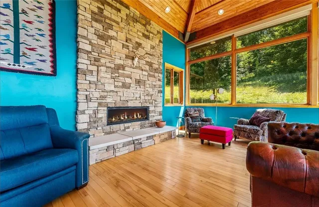 a living room with furniture city view and large windows