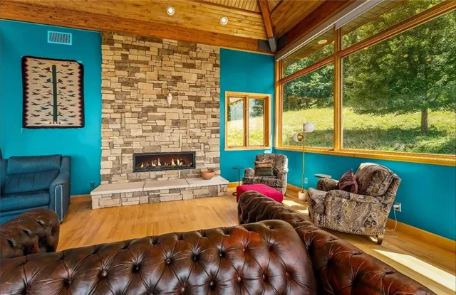 a outdoor space with balcony a couch and chairs