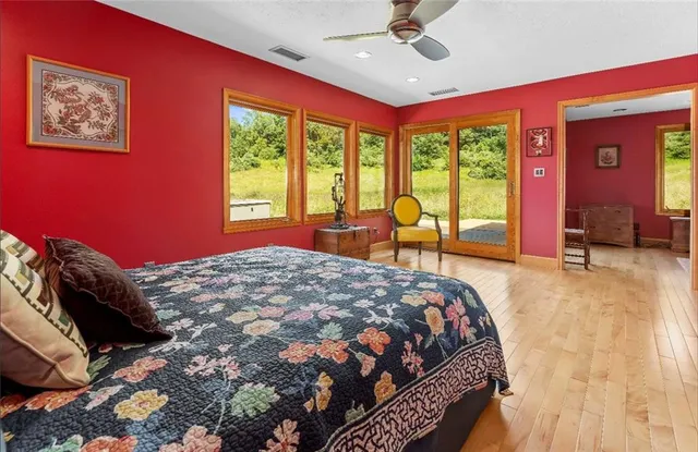 a view of a living room filled with furniture and a chandelier
