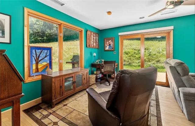 a room with furniture and large windows