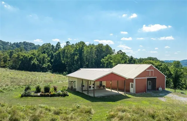 a view of a backyard with wooden fence