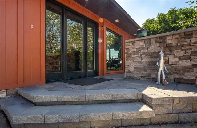 a view of house with backyard outdoor seating and plants