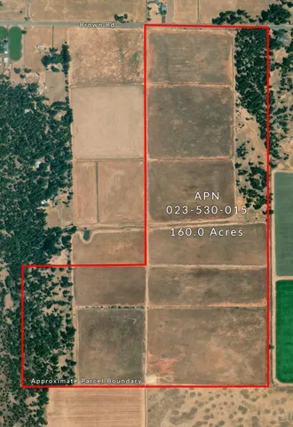 a view of a swimming pool with a patio and a yard