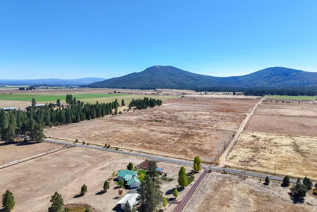 a view of a town with mountains in the background