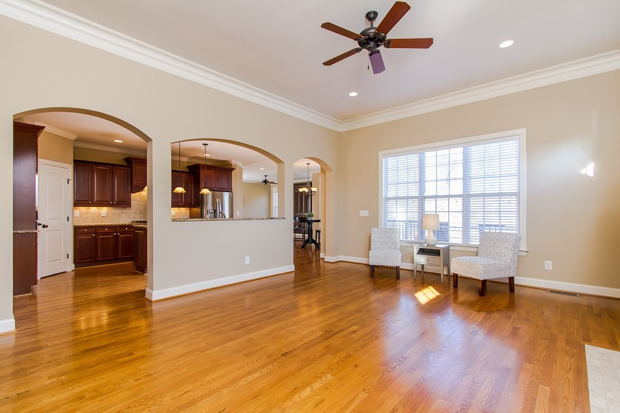 9316 Tabriz Point Raleigh, NC 27614 - Photo 7 of 25 Dramatic arches lead you from family room to kitchen Living Room