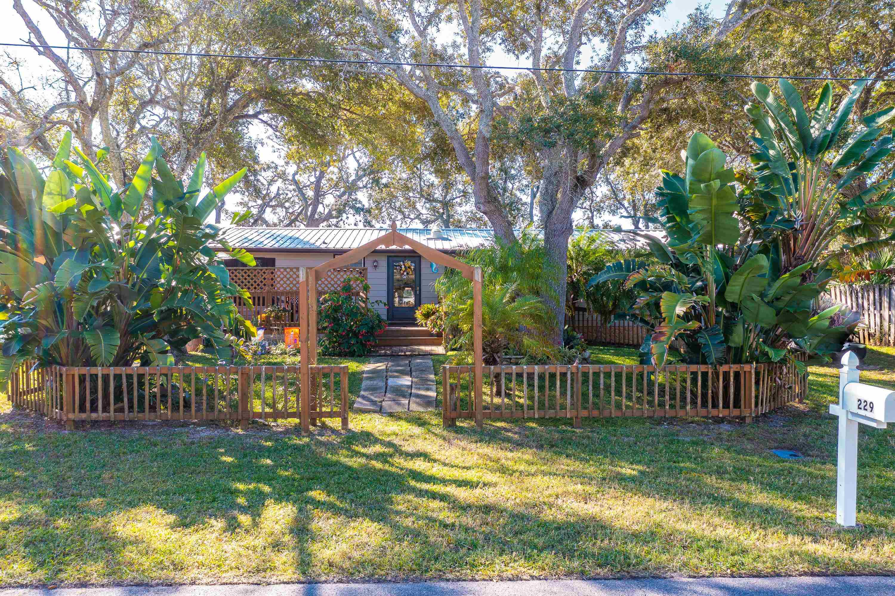 229 Barco Road St. Augustine, FL 32080 - Photo 1 of 46 a view of an house with backyard and a slide