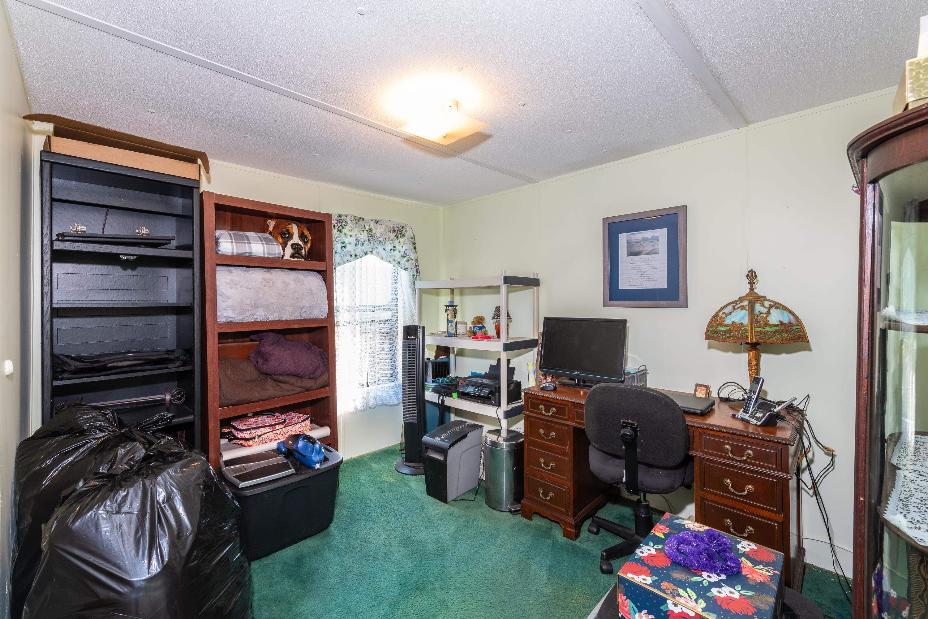 229 Barco Road St. Augustine, FL 32080 - Photo 21 of 46 a room with furniture a flat screen tv and a window