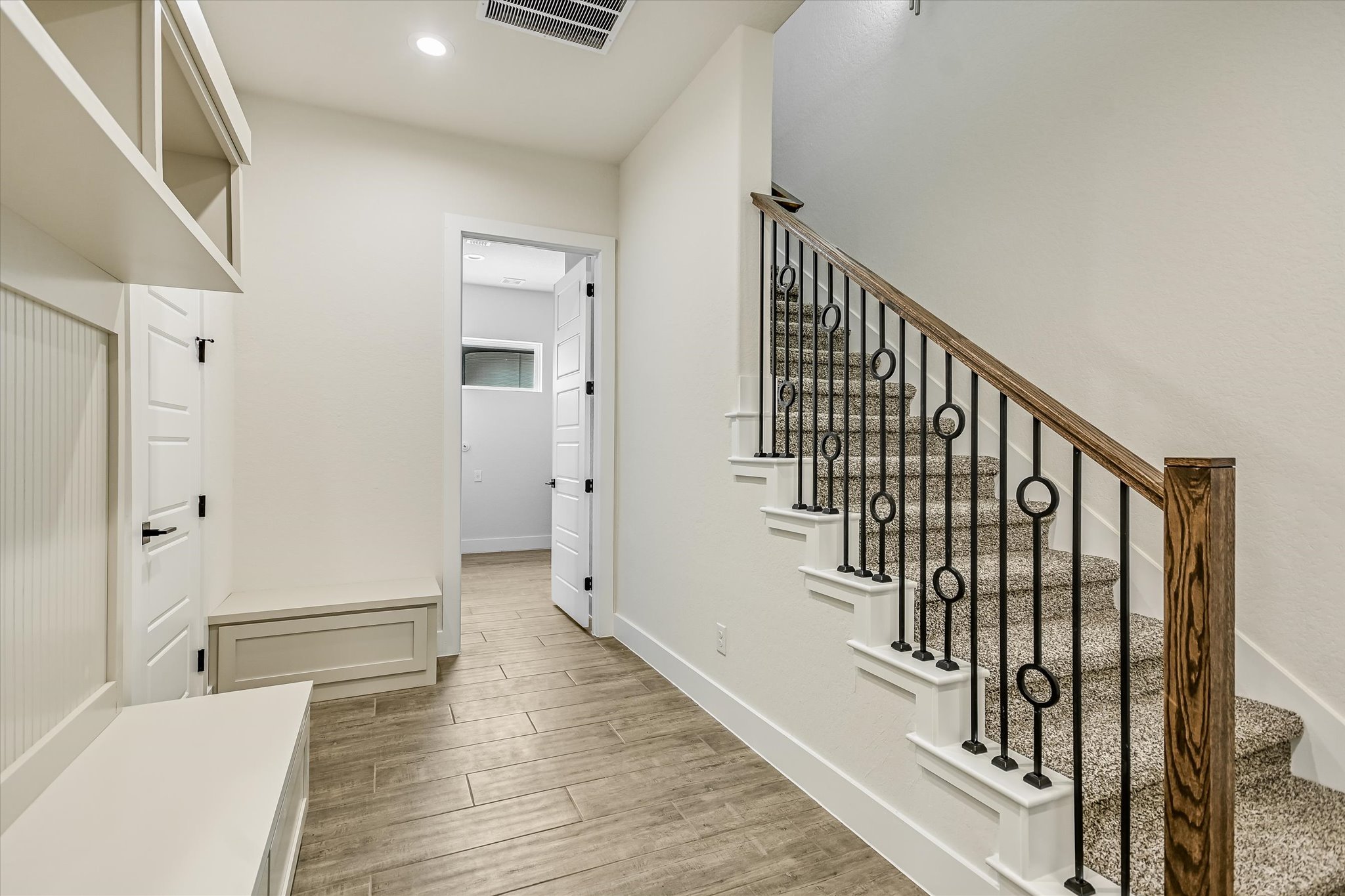 32 Peace Pipe Wimberley, TX 78676 - Photo 10 of 20 Stairway with wood finished floors and recessed lighting