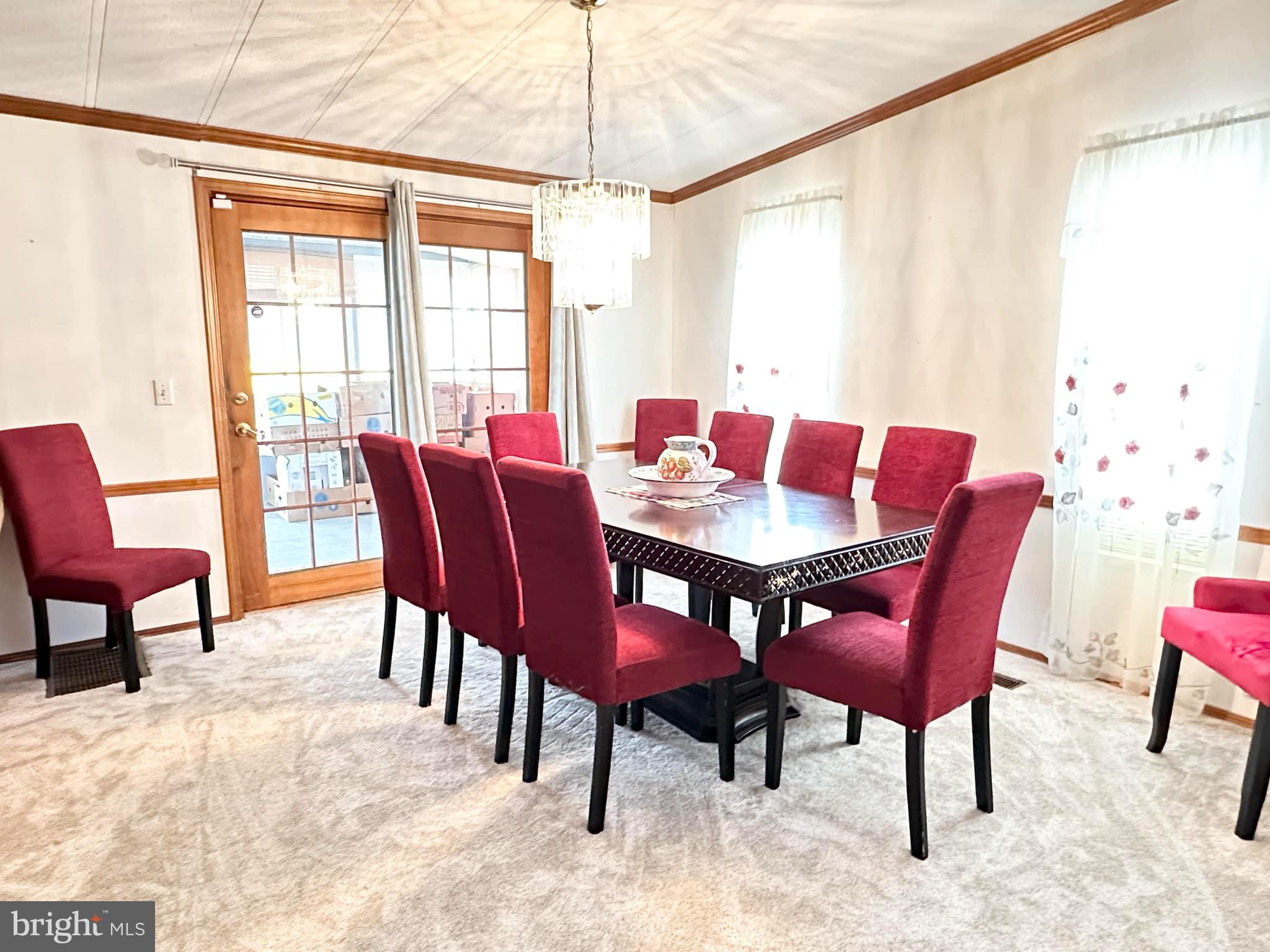 314 John Alden Drive Buena, NJ 08310 - Photo 14 of 23 a view of a dining room with furniture window and outside view