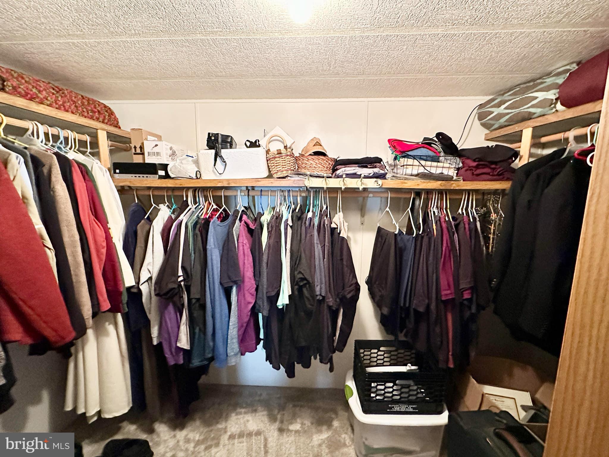 314 John Alden Drive Buena, NJ 08310 - Photo 22 of 23 a view of walk in closet with clothes and shoes