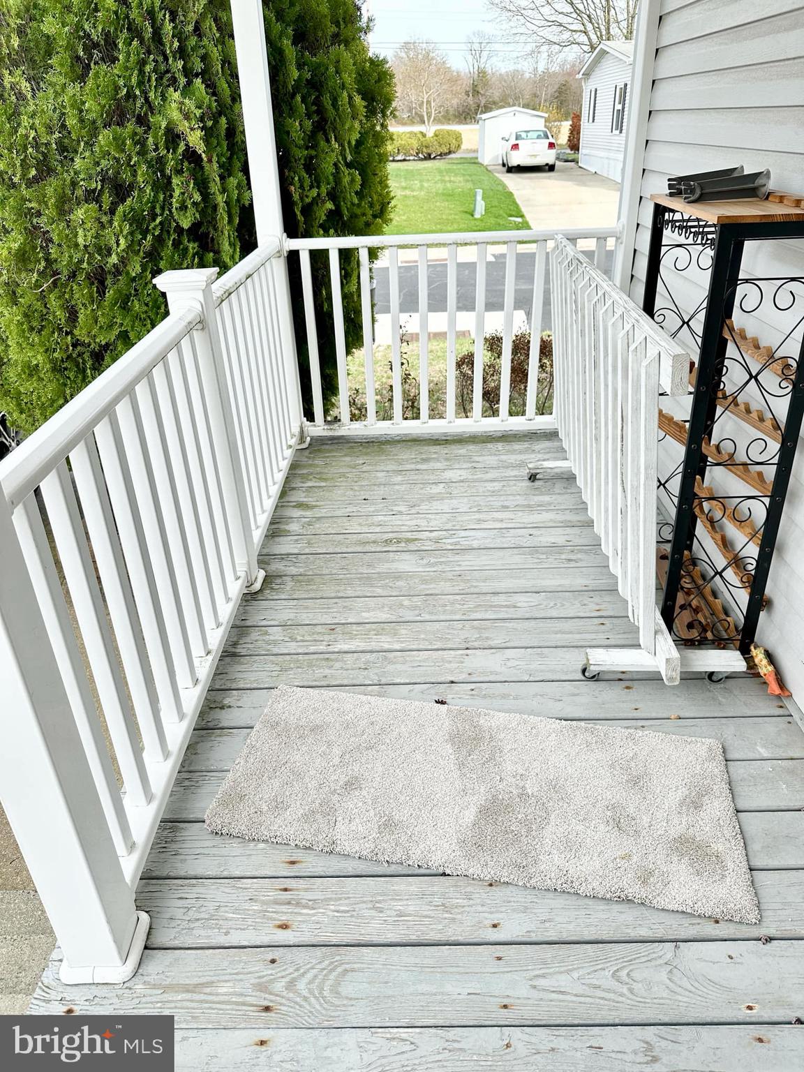 314 John Alden Drive Buena, NJ 08310 - Photo 9 of 23 a view of balcony with wooden floor and seating space