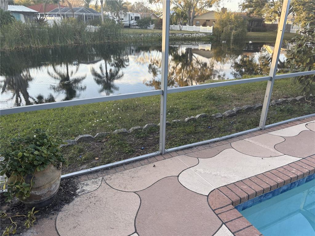 Undisclosed Address St. Petersburg, FL 33708 - Photo 11 of 11 a view of a lake from a balcony