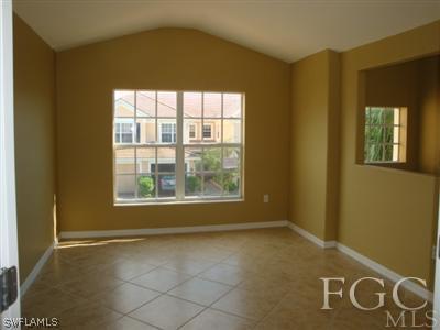 2623 Somerville Loop, Unit 508 Cape Coral, FL 33991 - Photo 2 of 10 an empty room with windows
