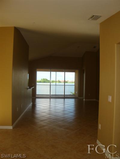 2623 Somerville Loop, Unit 508 Cape Coral, FL 33991 - Photo 3 of 10 a view of an empty room and window