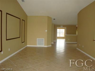 2623 Somerville Loop, Unit 508 Cape Coral, FL 33991 - Photo 4 of 10 a view of a hallway with wooden floor